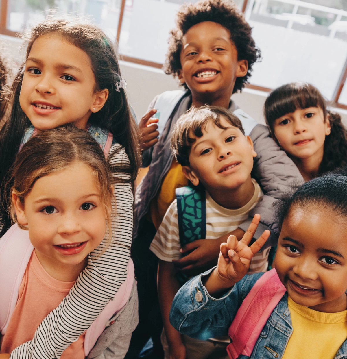 Kids posing together in a classroom